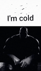 a black and white photo of thanos sitting in a chair with the words `` i 'm cold '' written above him .