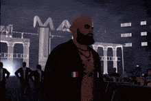 a man with a beard is walking in front of a building that says ma