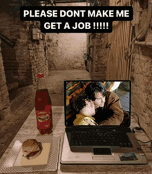a laptop is on a desk with a bottle of sprite on it
