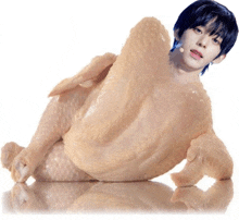 a picture of a man laying on a chicken