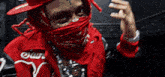 a man wearing a red jacket that says earl