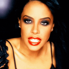 a close up of a woman with red lipstick on her lips