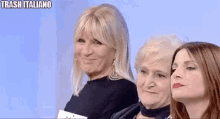 three women are standing next to each other and the words trash italiano are on the bottom