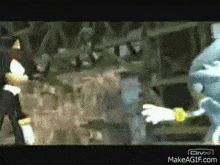 a group of people are standing next to each other in a room in a video game .