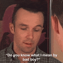 a man in a plaid shirt says " do you know what i mean by bad boy ? "