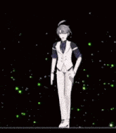 a man in a tuxedo is dancing on a stage in the dark