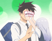 a cartoon of a man covering his face with cards