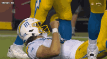 a football player wearing a white helmet with the number 10 on it