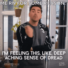 a man standing in front of a door with a caption that says " me rn for some reason