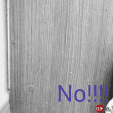 a black and white photo with the word no written in blue