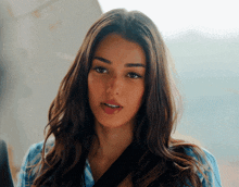 a close up of a woman 's face with long hair
