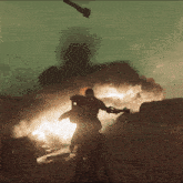 a man standing in front of a large explosion
