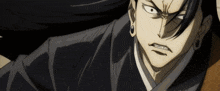 a close up of a man 's face with a very angry expression