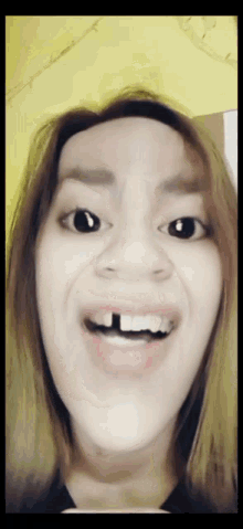 a close up of a woman making a funny face