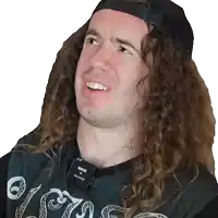 a man with long curly hair is wearing a rode microphone on his neck