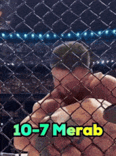 a man is behind a chain link fence with the words 10-7 merab on the bottom