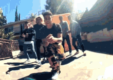 a group of young men standing around a skateboarder