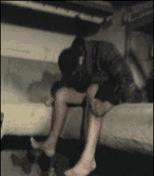 a blurry picture of a person sitting on a couch