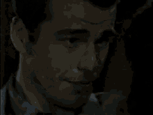 a man and woman are kissing in the dark