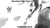 a black and white photo with the words rhea ripley wwe theme slowed