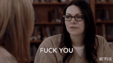 a woman with glasses says " fuck you " in front of a netflix logo