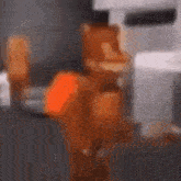 a blurred image of a person standing next to a table with a blender .