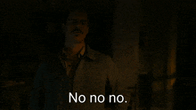 a man with a mustache is standing in the dark and says take your time
