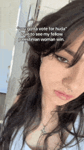 a close up of a woman 's face with the words " you gotta vote for huda "