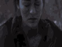 a blurry picture of a man 's face with a purple background