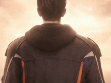 a man in a leather jacket with a hood