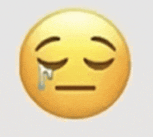 a close up of a crying emoji with a tear coming out of its eye .