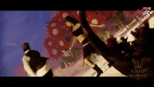 a woman in a crop top is dancing in front of a crowd of people .