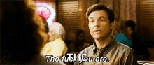 a man is talking to a woman in a restaurant and says `` the fuh you are . ''