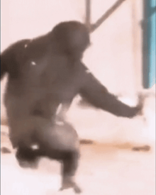 a blurry picture of a person in a hoodie