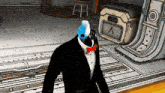 a man in a tuxedo and bow tie is standing in a room with a blue and white mask on his head .
