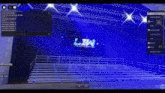 a computer screen shows a stage with bleachers and a large screen that says l & w on it .
