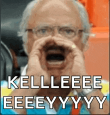 a man with glasses and a beard is screaming kelleeee eeeeyyy