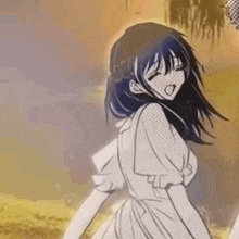 a girl in a white dress is standing in a field with her mouth open .
