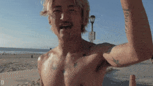 a shirtless man with a tattoo on his arm that says " roof "