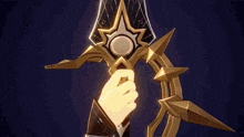 a person is holding a gold sword with a star on it .