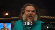 a man with a beard is wearing a blue shirt that says chic i win