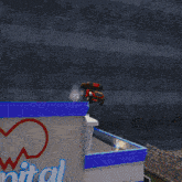 a red car is turned upside down on the ground