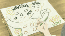 a person is drawing a picture of a boy and a girl