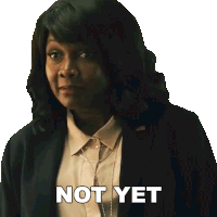 a woman in a suit has the words not yet written on her face