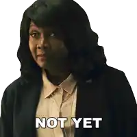 a woman in a suit has the words not yet written on her face