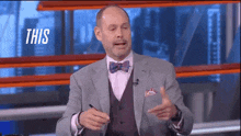 a man in a suit and bow tie says this on a television show