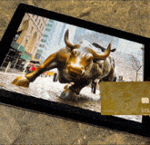a tablet with a picture of a bull and a gold card
