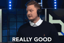 a man wearing headphones says " really good "