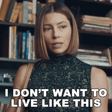 a woman says i don 't want to live like this in front of a bookshelf
