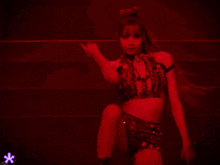 a woman holding a microphone in front of a red light that says isv